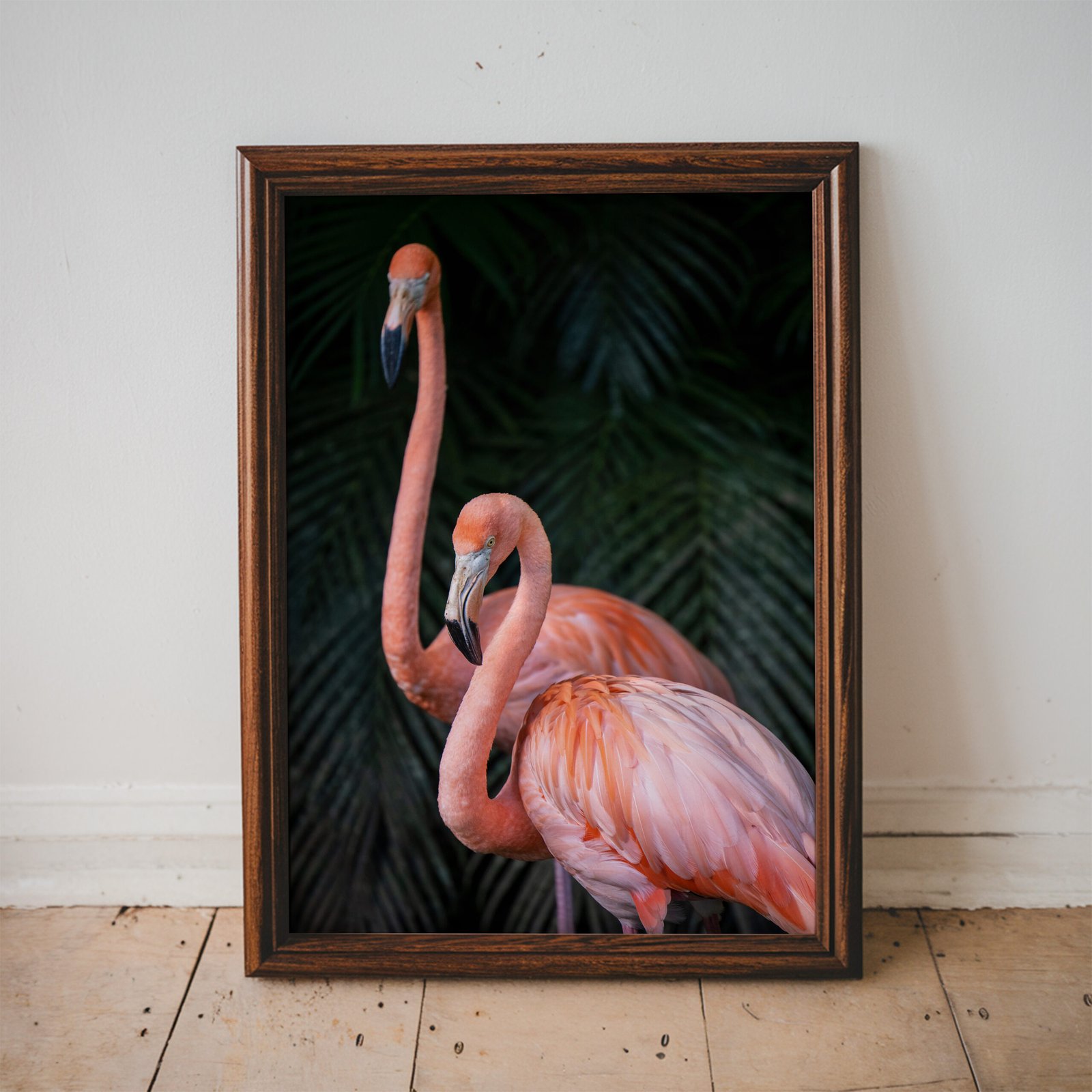 two flamingoes in palms