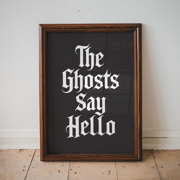 Minimalist Halloween typography print featuring the phrase "The Ghosts Say Hello" in white gothic lettering on a black background.